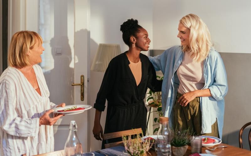 a group of women standing in a room